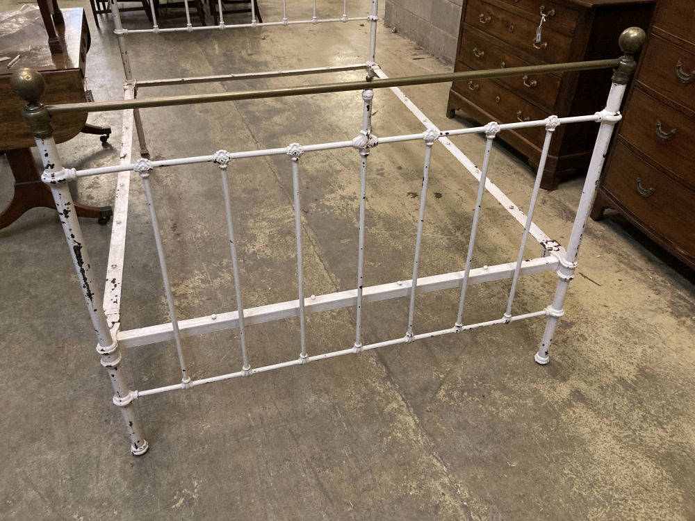 A late Victorian iron and brass double bed frame, width 54cm height 141cm